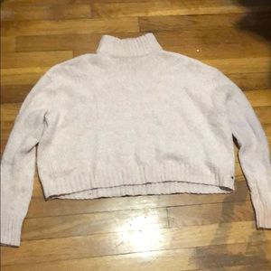 Cropped pink turtleneck sweater